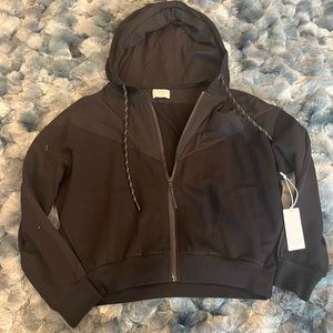 Black activewear zip up hoodie. Pockets and fleece lining